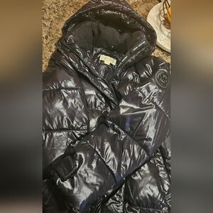 Michael Korrs long puffer coat
